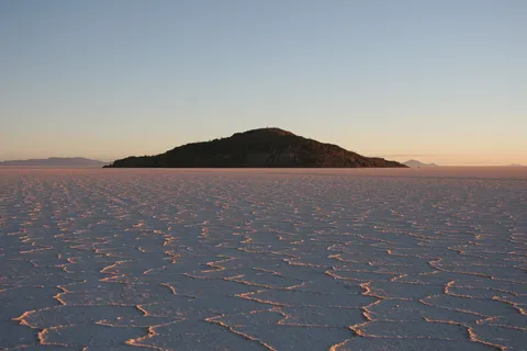 Isla Incahuasi and salt hexagons at sunrise, Bolivia — Nicolas Marincic