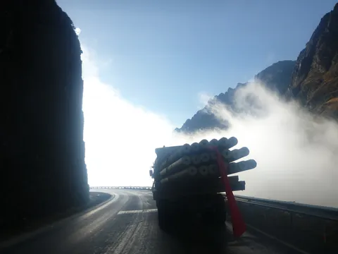 Lorry in the mist on the Yungas Road, Bolivia — Nicolas Marincic