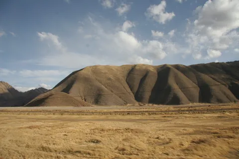 Bare hills above high-altitude grassland, Peru — Nicolas Marincic