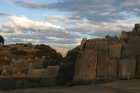 Giant fitted stones in golden light, Sacsayhuamán, Peru — Nicolas Marincic