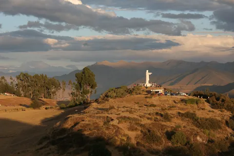 Cristo Blanco above Sacsayhuamán at sunset, Peru — Nicolas Marincic