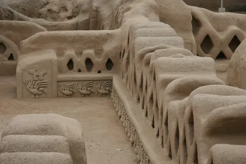 Lattice walls and niches of the arabesque courtyard, Chan Chan, Peru — Nicolas Marincic
