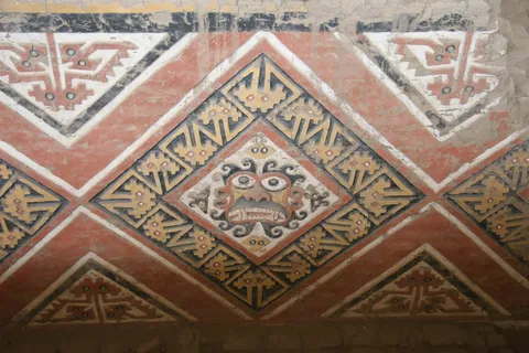 Red, yellow and black rhomboid reliefs, Huaca de la Luna, Peru — Nicolas Marincic