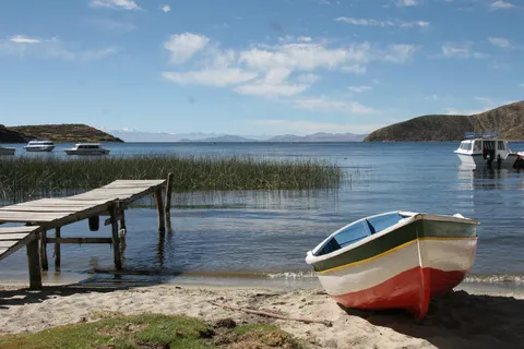 Painted boat and jetty, Challapampa bay, Isla del Sol, Bolivia — Nicolas Marincic