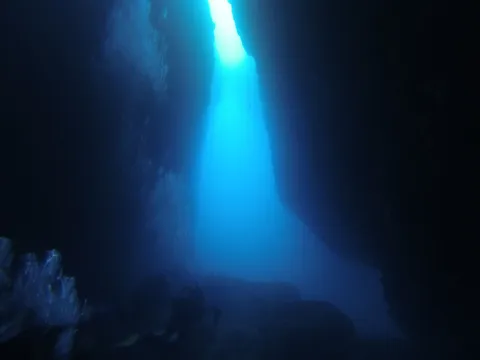 Shaft of light in a cave, Medes Islands, Spain — Nicolas Marincic
