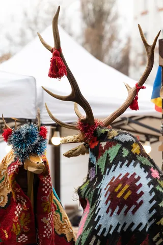 Folk deer masks at the Bucharest Christmas fair, Romania — Nicolas Marincic