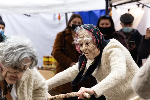 Masked “old woman” in a winter ritual dance, Bucharest, Romania — Nicolas Marincic