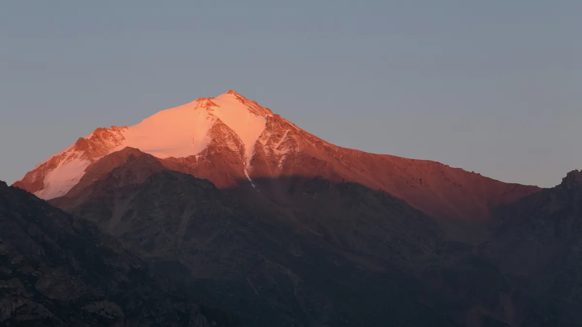 Alpenglow on a Tian Shan peak above Big Almaty Lake, Kazakhstan — Nicolas Marincic