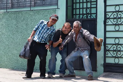 Three friends striking a pose, El Salvador — Nicolas Marincic