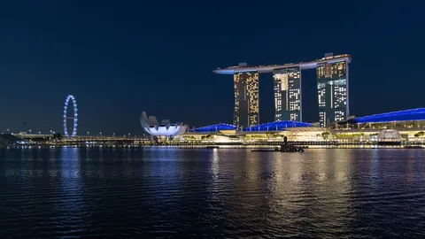Marina Bay Sands and the Singapore Flyer at night, Singapore — Nicolas Marincic