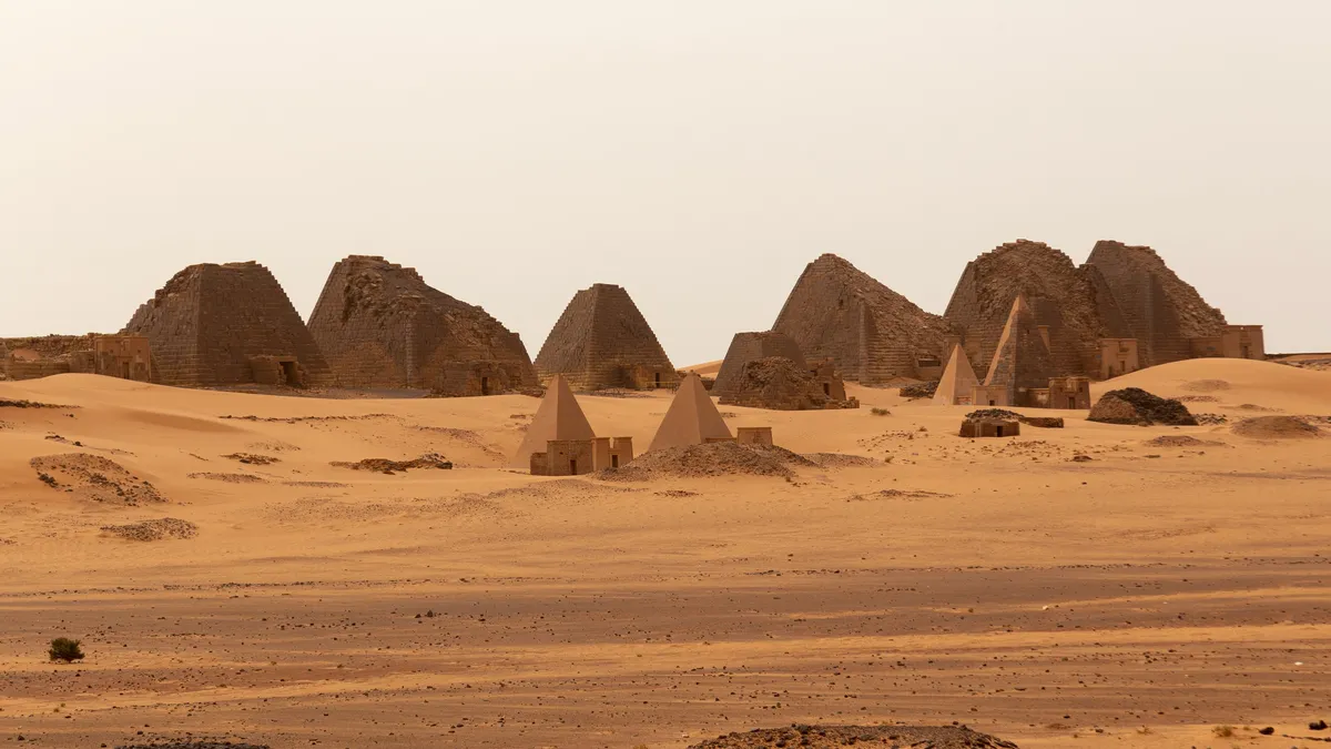 Meroë northern cemetery across the desert, Sudan — Nicolas Marincic