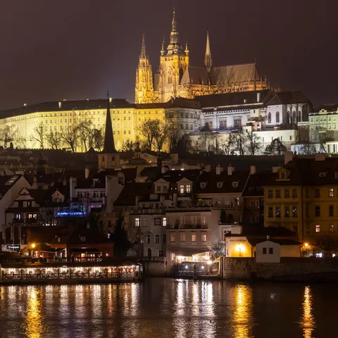 Prague Castle and St Vitus lit at night above the Vltava, Czechia — Nicolas Marincic