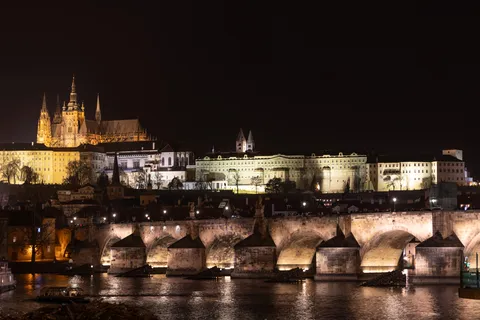 Prague Castle and Charles Bridge lit at night, Czechia — Nicolas Marincic