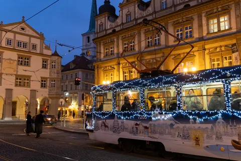 Christmas-lit tram in Malá Strana square at blue hour, Prague, Czechia — Nicolas Marincic