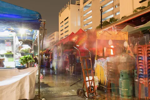 Market stalls in the rain, Thailand — Nicolas Marincic