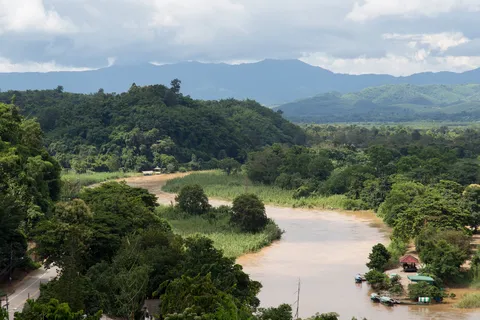 River winding through wooded hills, Thailand — Nicolas Marincic