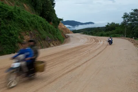 Scooter on a country dirt road, Thailand — Nicolas Marincic