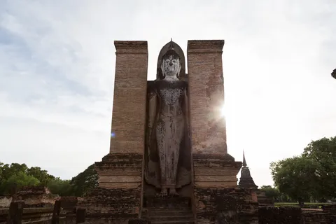 Standing Buddha between two pillars, Sukhothai, Thailand — Nicolas Marincic