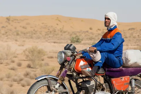 Motorcyclist in the Karakum Desert, Turkmenistan — Nicolas Marincic