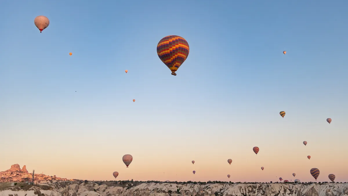 Hot-air balloons at dawn over Cappadocia, Turkey — Nicolas Marincic