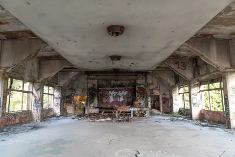 Vast gutted hall of an abandoned sanatorium, France — Nicolas Marincic