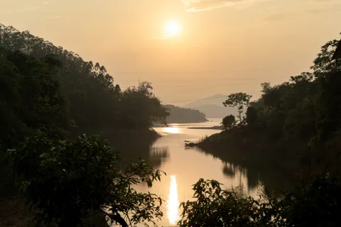 Sunset over a lake among the hills, Vietnam — Nicolas Marincic