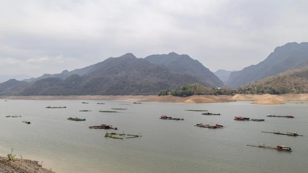 Boats on a lake among the mountains, Vietnam — Nicolas Marincic