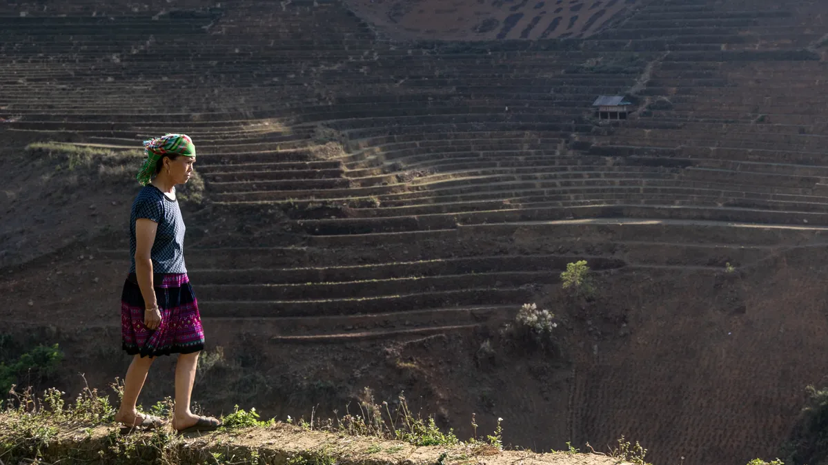 Woman in a green headscarf above the terraces, Vietnam — Nicolas Marincic